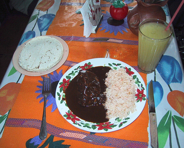 Black mole over chicken and rice is one authentic dish in Mexico.