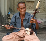 A musician in Cambodia playing.