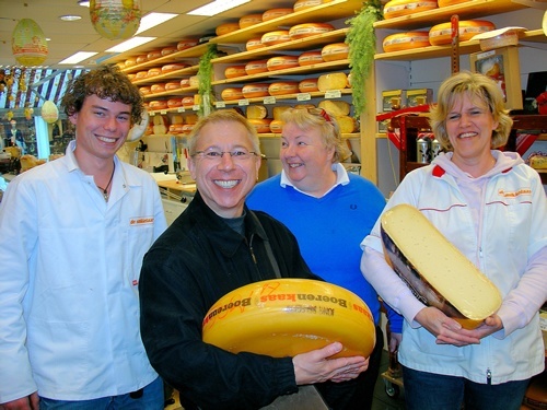 Volendam, Netherlands with author holding cheese.