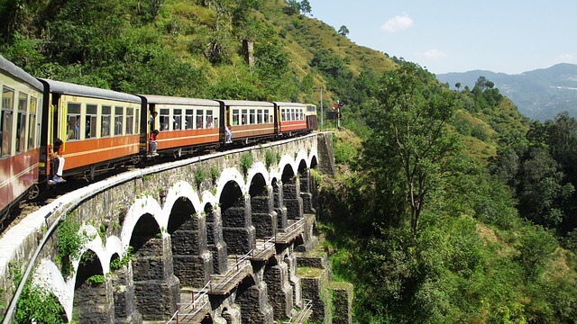 Train journeys in India, as one weaves through the green mountains.