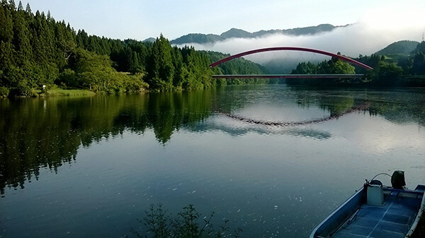 The red bridge crossing the river in Toyomi.