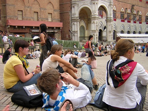 Interns relaxing at Palio in Siena, Italy.