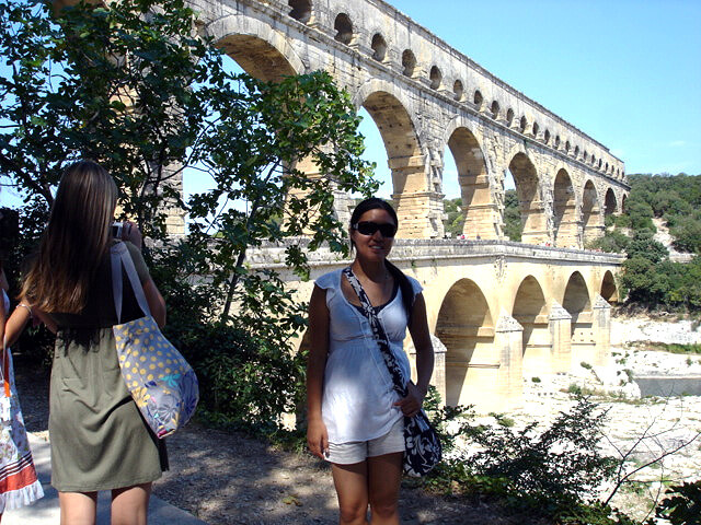 Author standing in front of the Ancient Roman Pont du Gard in Languedoc region of the south of France.
