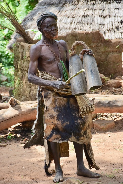 Dupa chief ringing bells to message his tribe members
