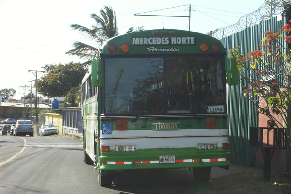 Taking bus in neighborhood in Heredia, Costa Rica
