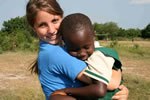 Teen volunteer abroad  with impoverished child