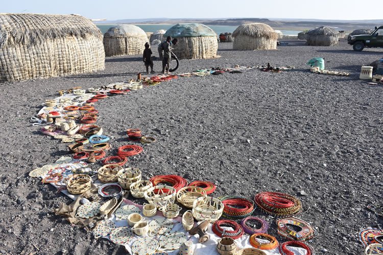 El Molo women display their crafts during a visit in Kenya.