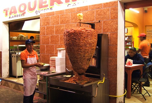 A big trompo of tacos al pastor in Mexico City