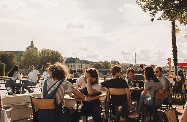 Hanging out at a café in Paris along the Seine River.