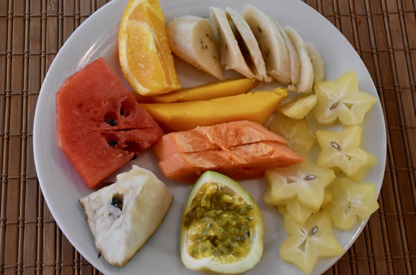 Fruit platter with star anise, sour sap, passion fruit, papaya, mango, watermelon, orange, and banana