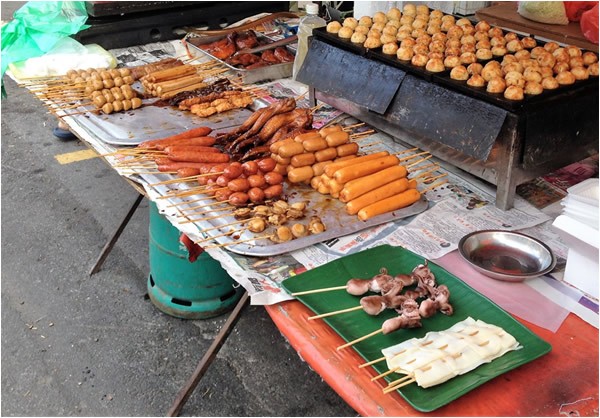 Grilled meat by street food vendors in Thailand