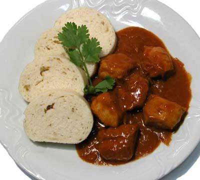 Goulash and dumplings on a plate is a typical Czech meal.