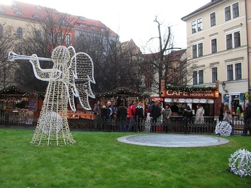A Czech angel made of Christmas lights in a park in Prague.