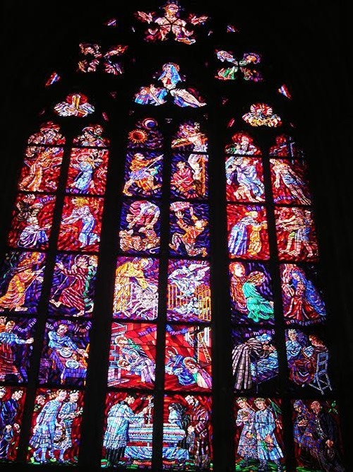 Stained glass window inside the famous St. Vitus Cathedral in Prague.