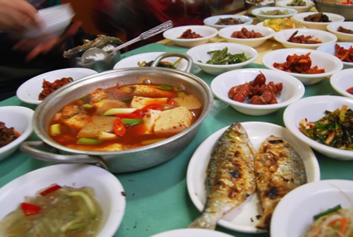 A  food spread, including kimchi.