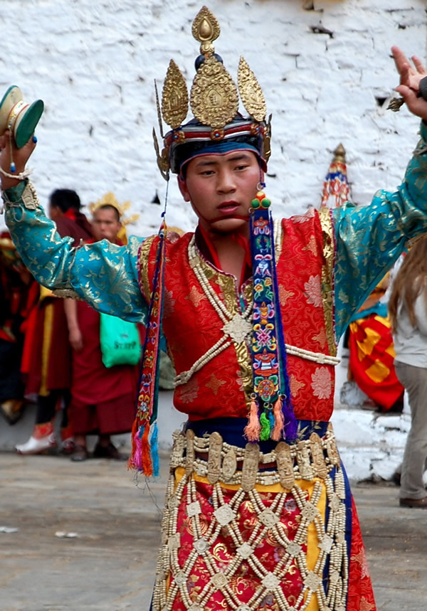 Bhutan Paro festival: dancer with hand bells