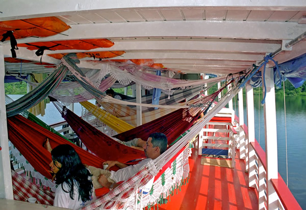 Riverboat in Brazil in South America with hammocks on deck