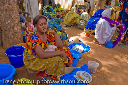 Fulani woman selling food at a market.