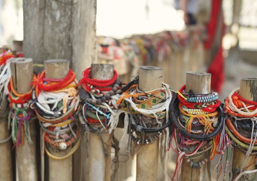 Bracelets left at a memorial at the Killing Fields of Choeung Ek, Cambodia