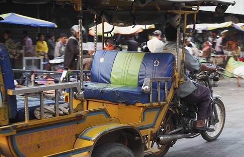 Tuk-tuk and driver awaiting next ride