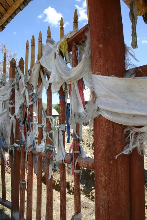 Prayer flags tied to a fence