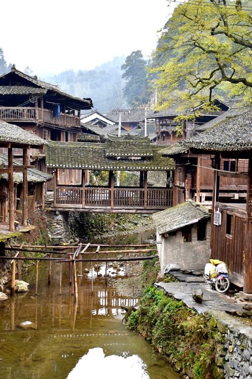 Wooden houses and covered bridge in Dong village