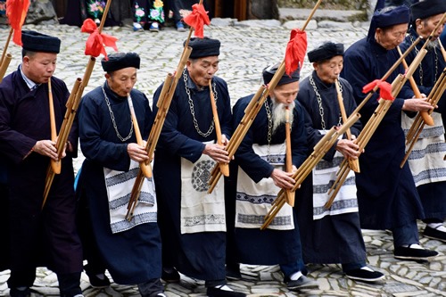 Miao elders playing the lusheng flute