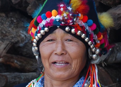 Aini woman with ceremonial headdress