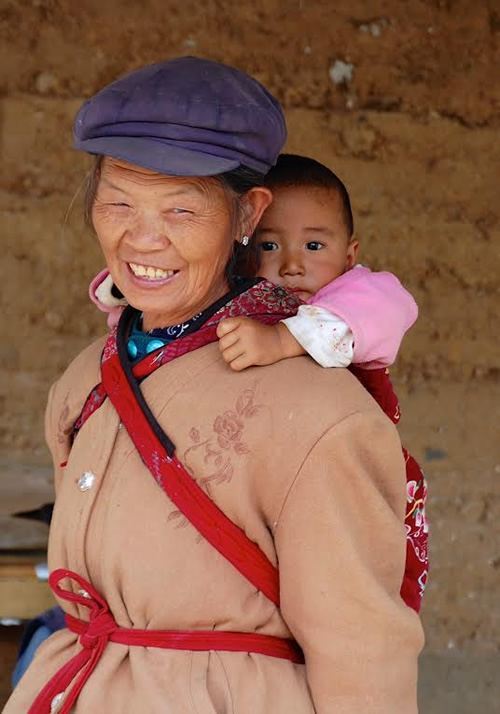 Naxi woman with child