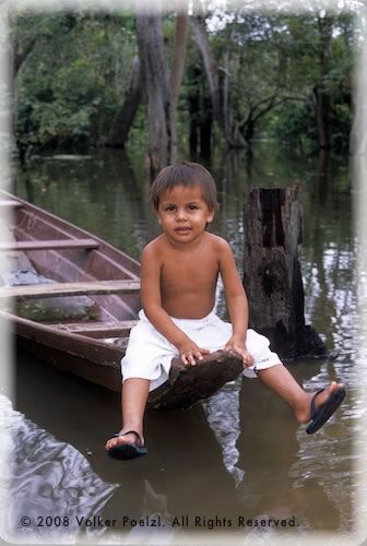 Boy on boat on Amazon