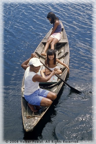 Amazon locals on canoes