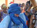 Festival on Niger with man dancing in blue