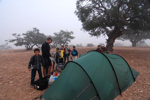 Cycling and camping in Morocco, with tent and bicycles.