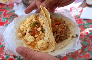 Quesadillas filled with scrambled eggs and beef ragout