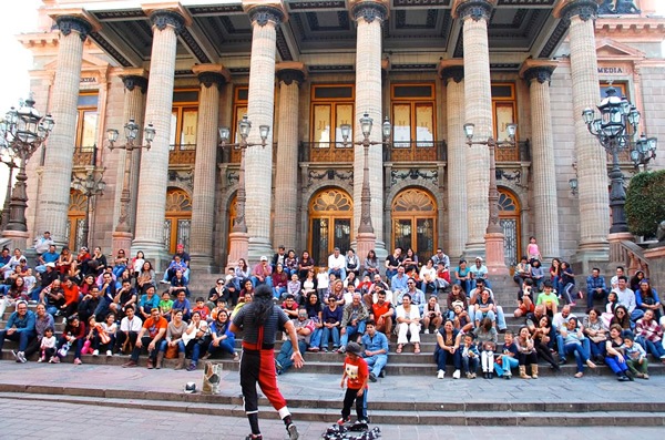 Street performer in front of the majestic Teatro Juarez in Guanajuato.