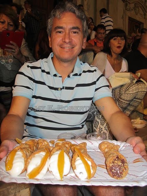 Luca offers cannoli in Sicily