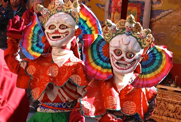 Monks dancing in colorful masks