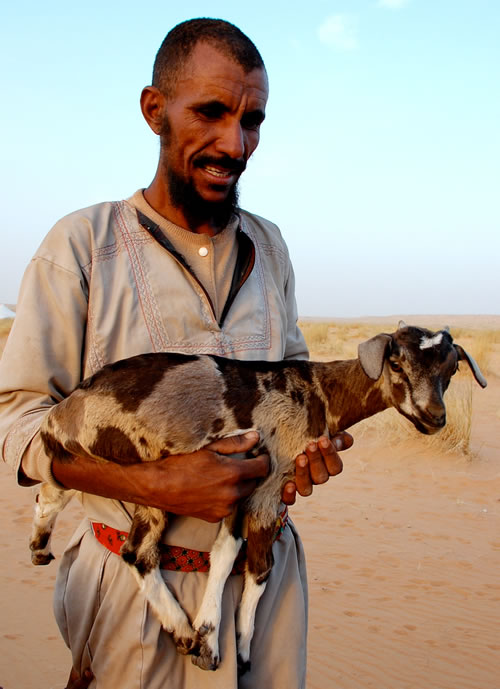 Man with Goat offering