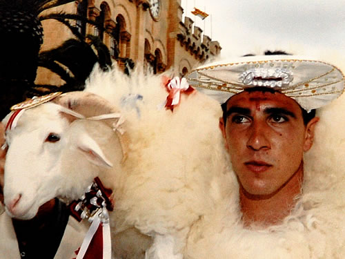 Man with a lamb at the Menorca festival