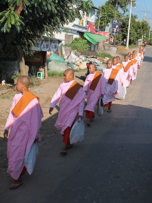 Nuns walking in file in Myanmar