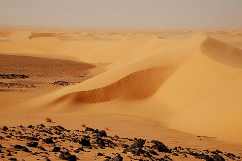 Passing through magnificent sand dunes.