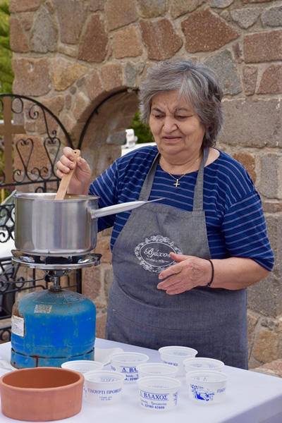 Mrs. Vlachos preparing yogurt from scratch