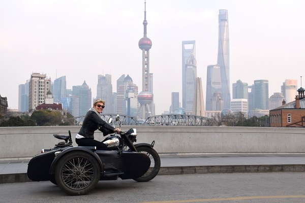 The author cruising Shanghai driving a vintage motor cycle