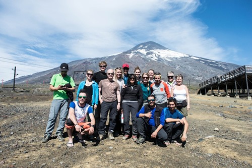 Small group travel: Team photo after scaling Volcano Villarrica in Chile