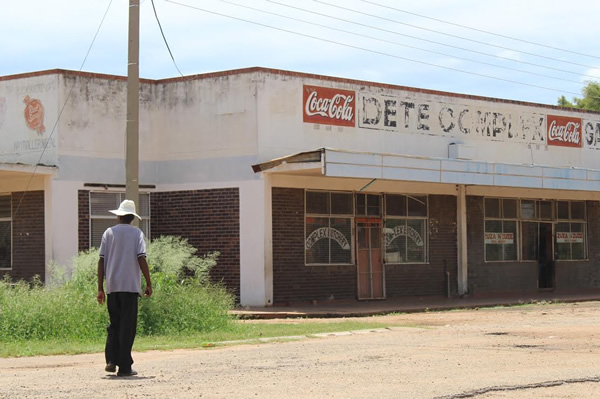 Man walking in Dete town, where many work in tourism.