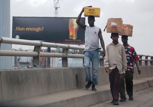 Men in Lagos returning from market