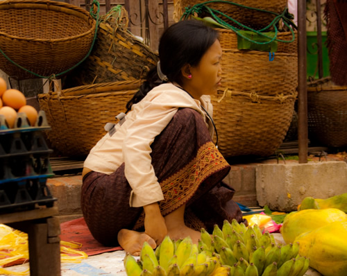 Child selling fruit in Laos