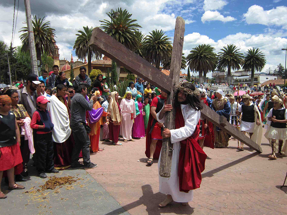 Christ carrying cross on Semana Santa (holy week of Easter) in Mexico