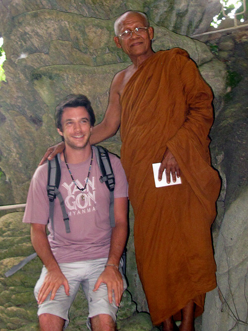 Monk with author in the cave.