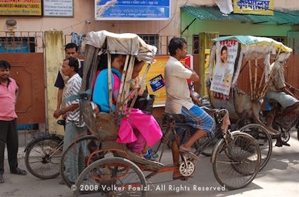 Street scene in India with a tuk-tuk is a colorful photography subject.